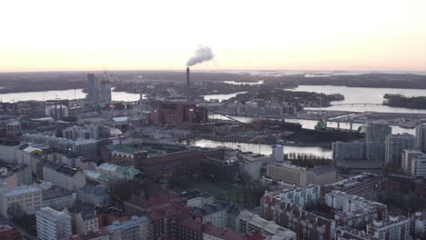 smoke exhaust from factory near the city center