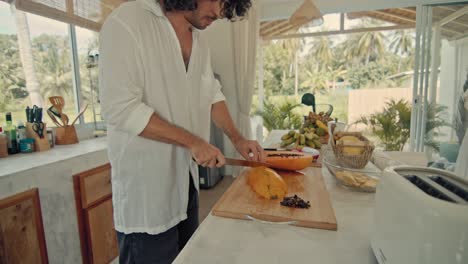 couple cooking breakfast in a tropical kitchen