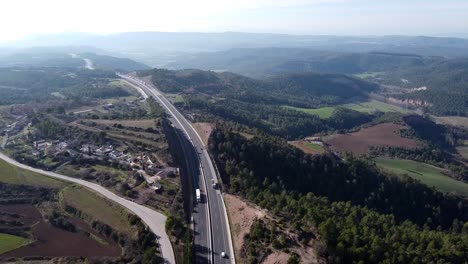 wide aerial panorama view of a road in the pyrenees mountains in spain