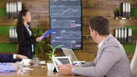 businessman working in the conference room holding charts