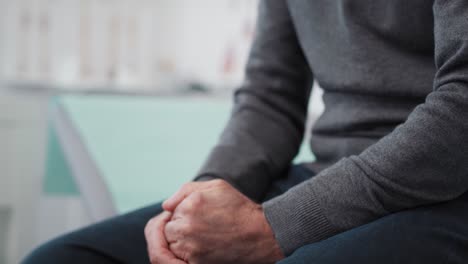 Handheld view of stressed and worried patient in doctor&rsquo;s office