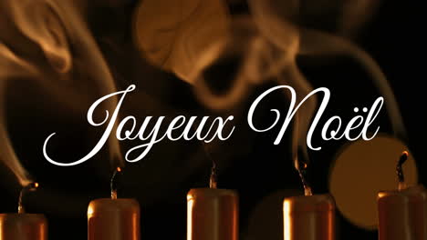 joyeux noã«l written over candles