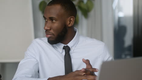 Young-man-speaking-at-the-office