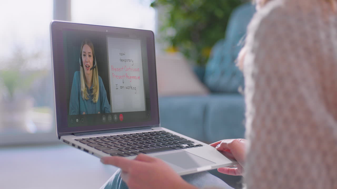 Female student watching online lesson