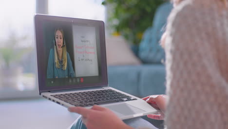 female student watching online lesson