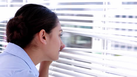 businesswoman spying on her colleagues