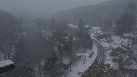 Rosendale,-New-York,-on-a-snowy,-beautiful-winter-day,-during-a-nor'easter,-as-seen-from-the-high-trestle-bridge,-over-the-Rondout-Creek,-on-the-Wallkill-Valley-rail-trail-far-above-the-village