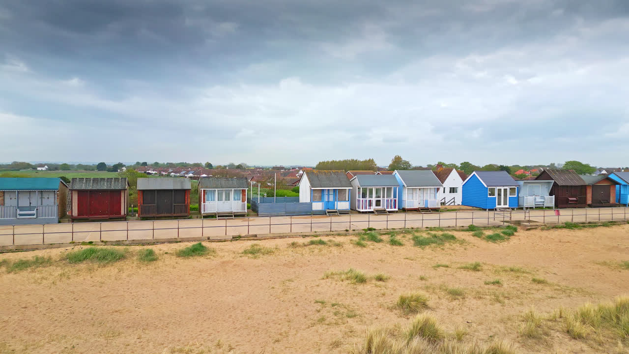 Marvel at Mablethorpe's beauty from the air, a Lincolnshire seaside gem, spotlighting beach huts, sandy beaches, and the bustling amusement parks with tourists