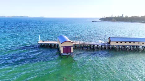 aerial view of a pier and coastal area