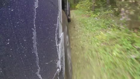 pov of pickup truck driving through a forest