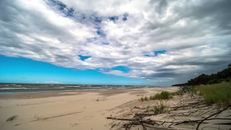 Clouds Rolling Over Sandy Beach and Sea Timelpase