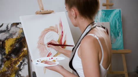 Woman-doing-a-painting-indoors