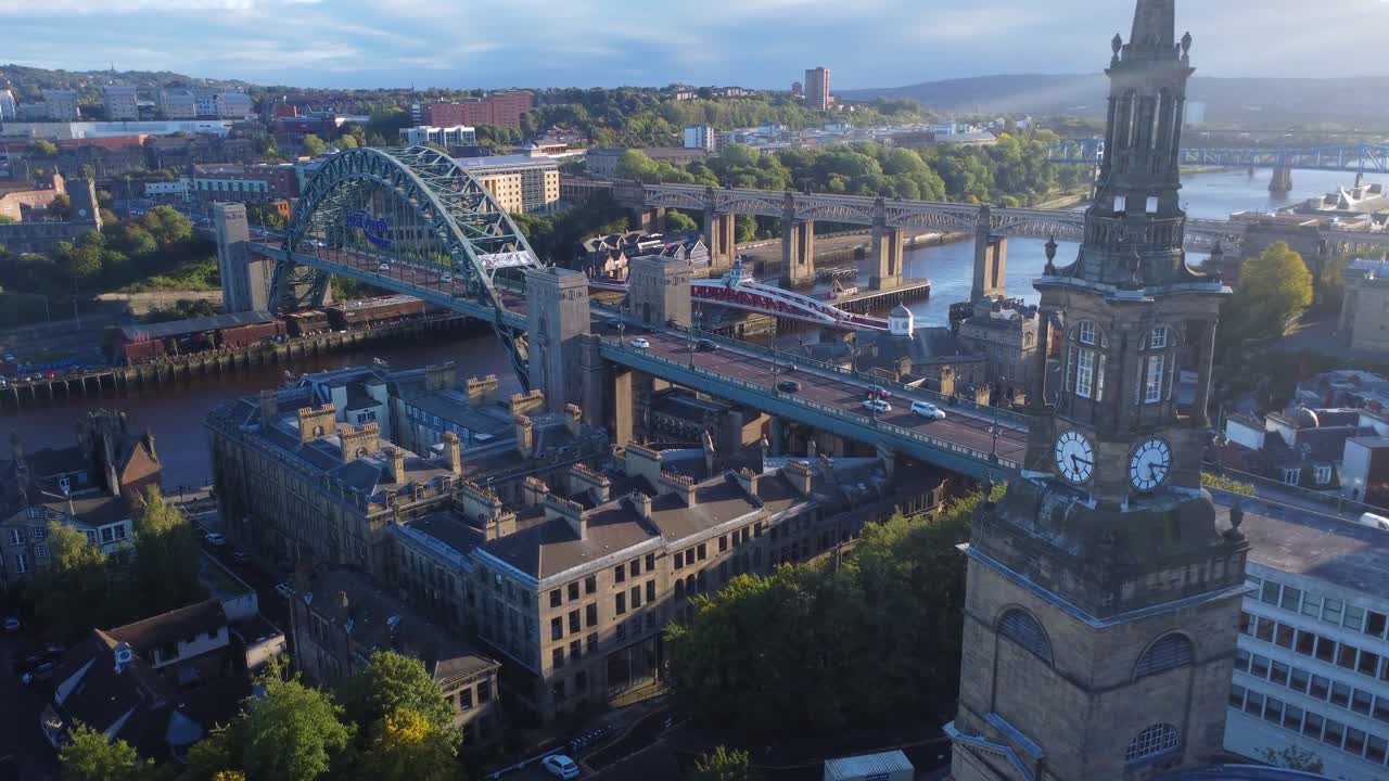 Drone view over beautiful Newcastle Quayside with Tyne Bridge at golden hour - England