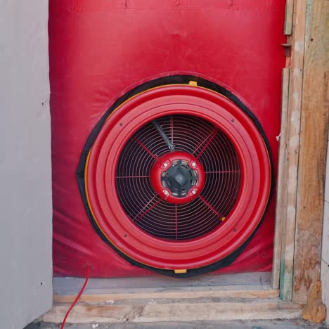 testing the house for airtightness on the front door installed a powerful fan