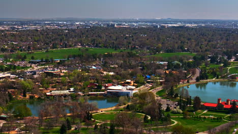 ferril duck lake city park pavilion golf course downtown denver cityscape colorado aerial drone the denver museum of nature and science building city living spring summer pan right motion