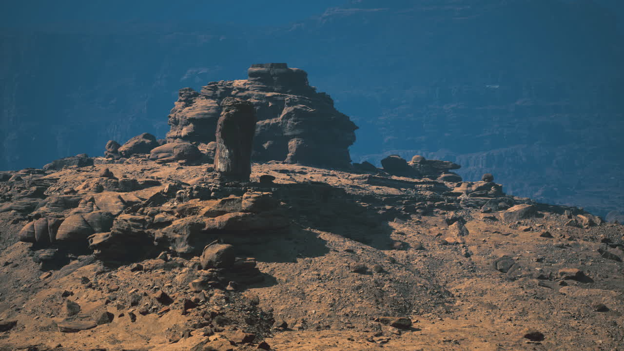 Rocky mountain formation in arid landscape during daylight hours