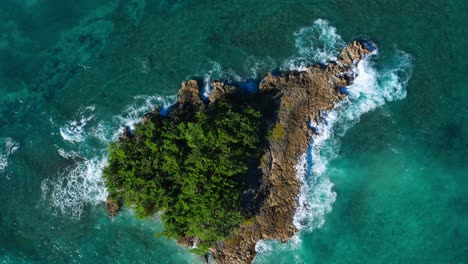 aerial top-down over big heart shaped rock in middle of ocean, dominican republic