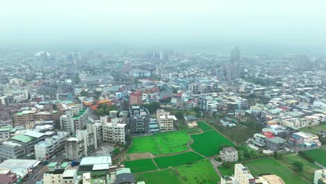 rising drone shot over miaoli city flying through dense clouds at sky