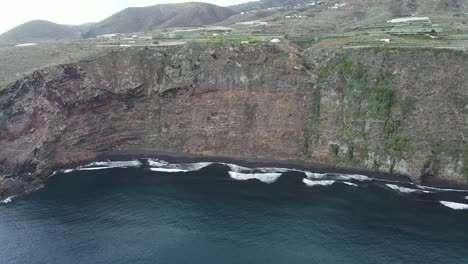Drone-aerial-view-of-Nogales-Beach-on-the-volcanic-island-of-La-Palma,-Canary-Islands