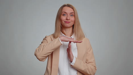 serious businesswoman showing time out gesture limit or stop sign no pressure i need more time