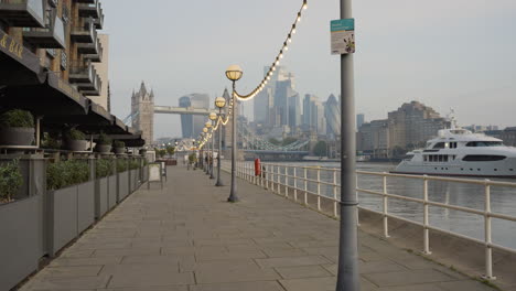 empty london walkway by tower bridge at dusk