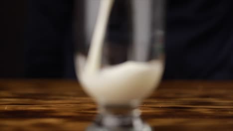 serving milk on glass slow motion macro shot 120 fps