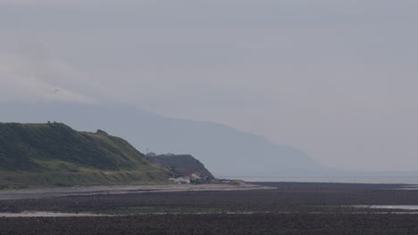 serene coastal landscape with cliffs and mountains