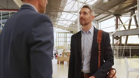 Colleagues-talking-in-the-foyer-at-a-business-convention