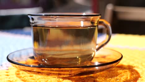 glass cup of tea on a table