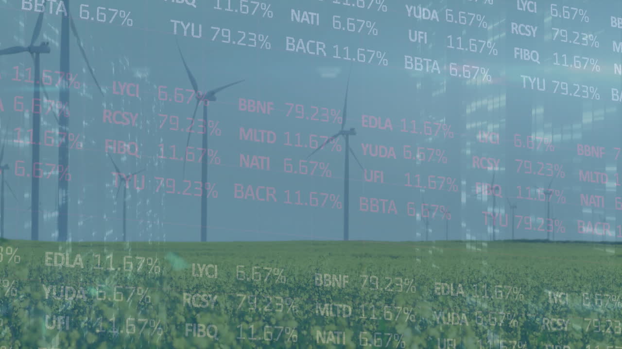 Wind turbines spinning in field with animation of stock market data overlaying scene