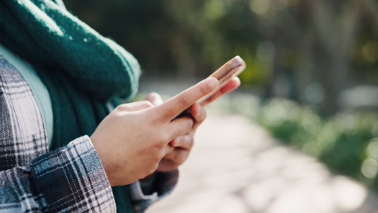 Person using a phone outdoors