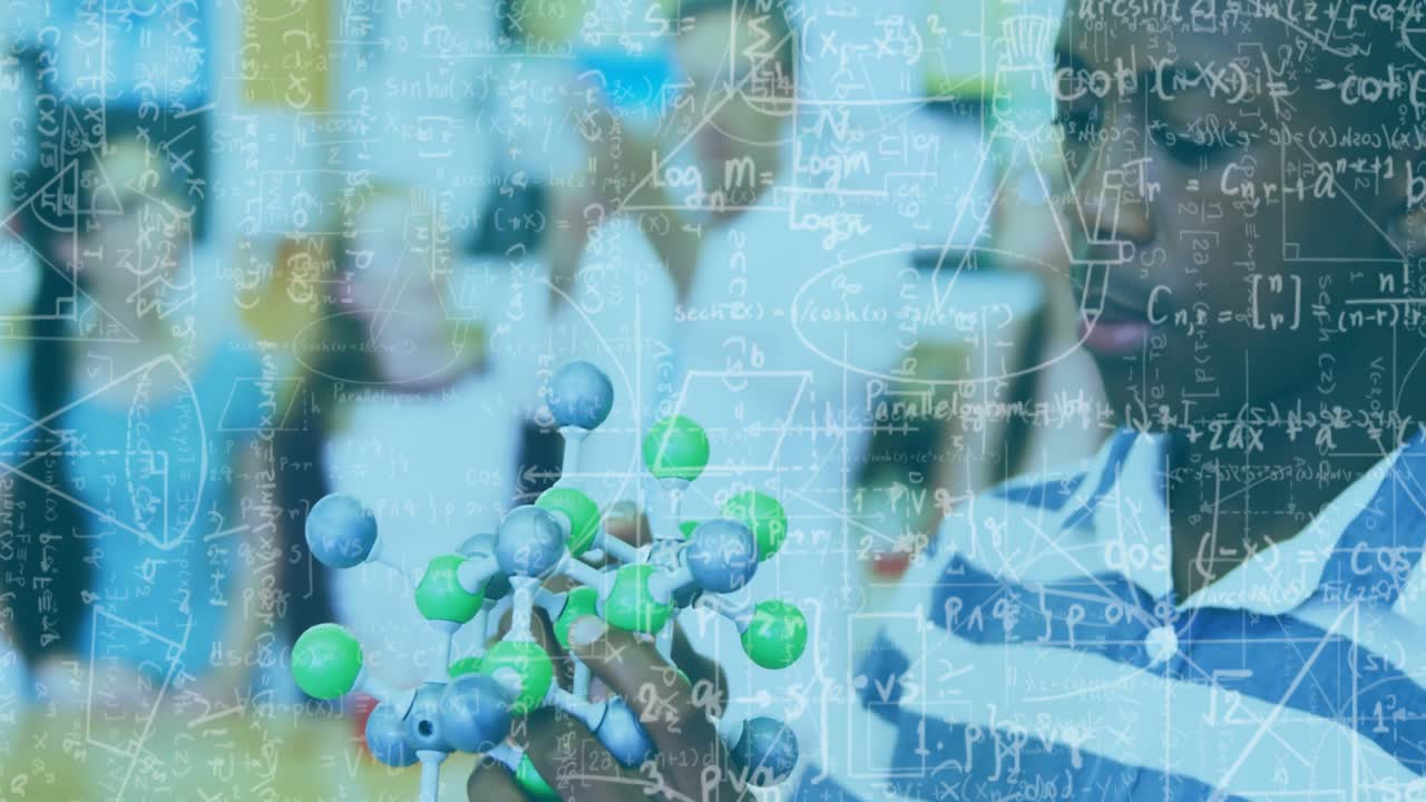 Teenage boy rotating molecular model in science lab, intensifying math formulas, geometric diagrams