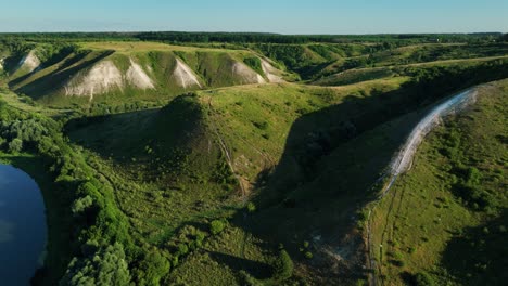 aerial view of rolling hills and a river