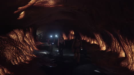 group exploring an illuminated cave