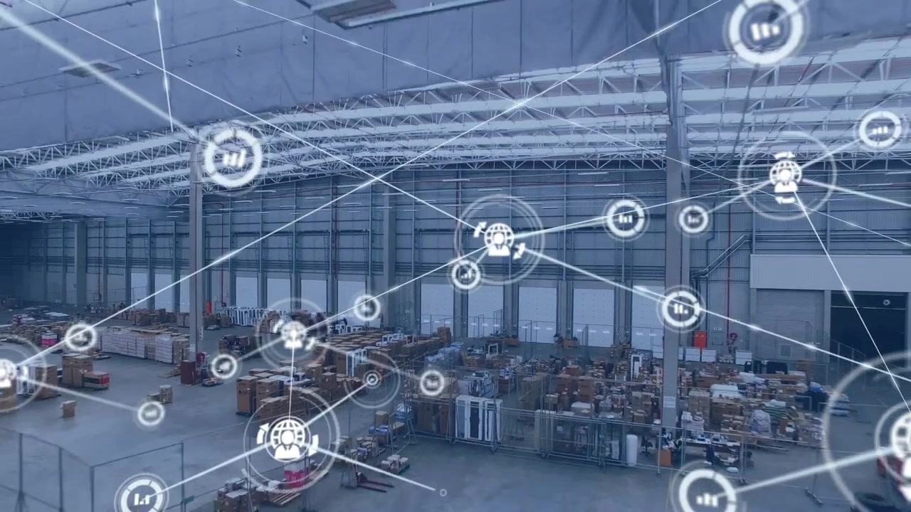 Animazione di icone di grafici e profili connesse tra loro su una vista aerea di scatole in un magazzino.