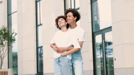 happy couple hugging outdoors