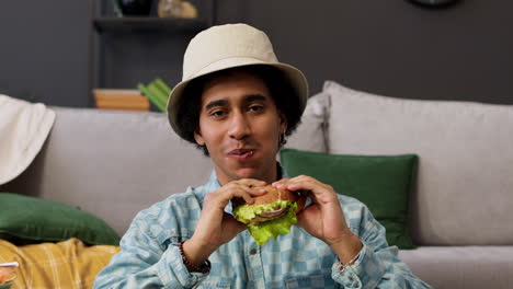 man eating burger