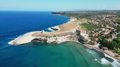 s' archittu arco beach at west coast of sardinia, italy - 4k aerial