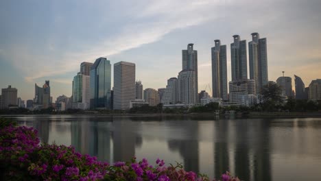 cityscape with reflection on lake at sunrise/sunset