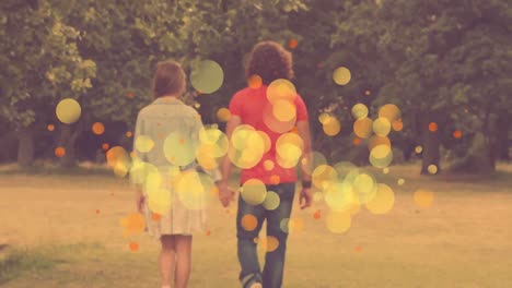 Caucasian-couple-handing-hand-and-walking-together-in-a-park