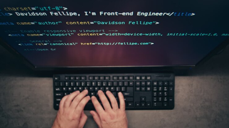 Person Coding on a Computer
