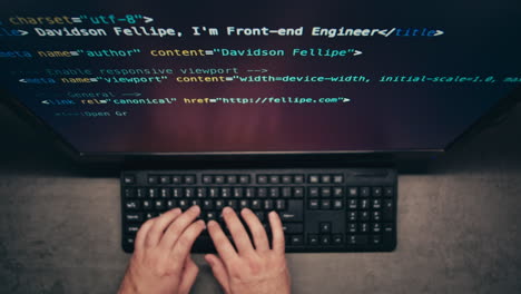 person coding on a computer