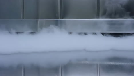 dense vapor cloud in a metallic industrial or laboratory setting