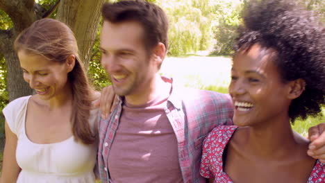 Four-friends-walking-together-in-the-countryside