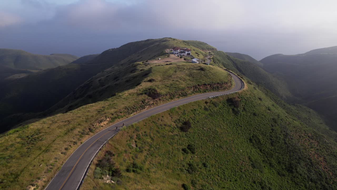 Longboarding down a road in california at high speed