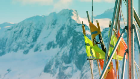 fishing flags with snowy mountains behind