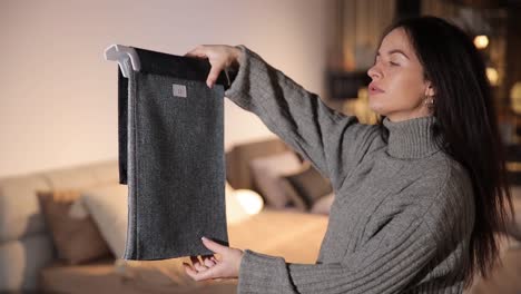 joyful woman on the infurniture store decides what fabric to choose for furniture joyful woman on the infurniture store decides what fabric to choose for furniture high quality footage