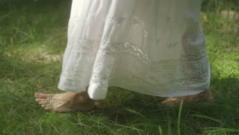 barefoot she walks on morning dew, in a white dress, the world feels new