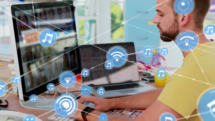 Animation of network of connections with icons over caucasian man using computer