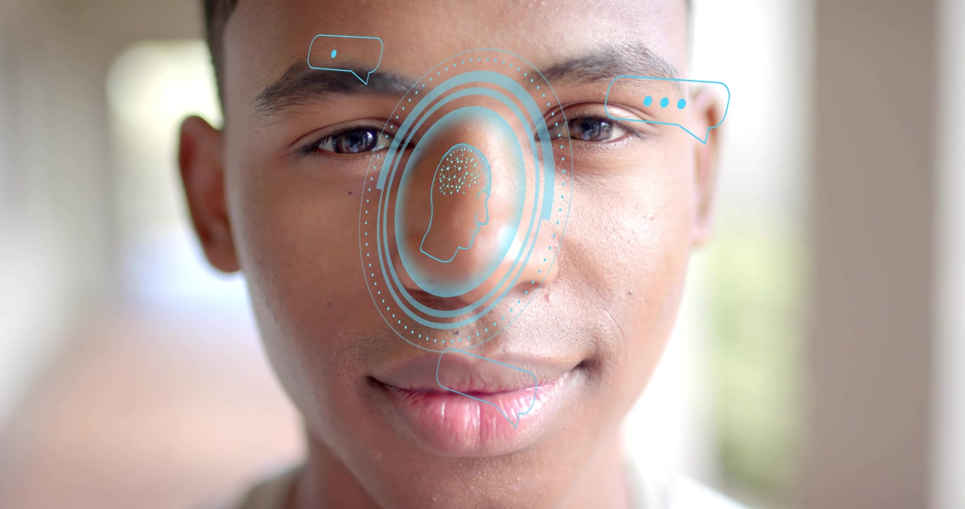 Teenage boy initiating blinking, pulsing digital interface and chat bubbles aligning for tech demo